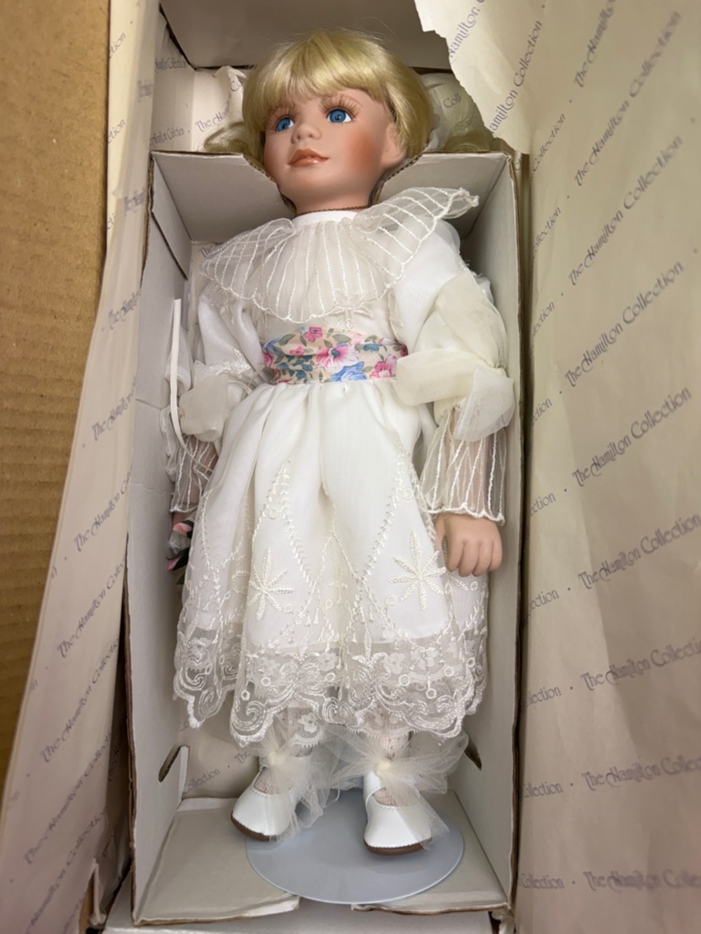 "April" Blonde Porcelain Doll in White Lace Dress with Floral Sash
